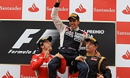 Гран При Испании  2012 г воскресенье 13 мая подиум Фернандо Алонсо Scuderia Ferrari, победитель гонки Пастор Мальдонадо Williams F1 Team и Кими Райкконен Lotus F1 Team