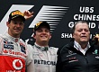 Гран При Китая  2012 г  воскресенье 15 апреля  Дженсон Баттон Vodafone McLaren Mercedes и Гран При Китая  2012 г  воскресенье 15 апреля  победитель гонки Нико Росберг Mercedes AMG Petronas